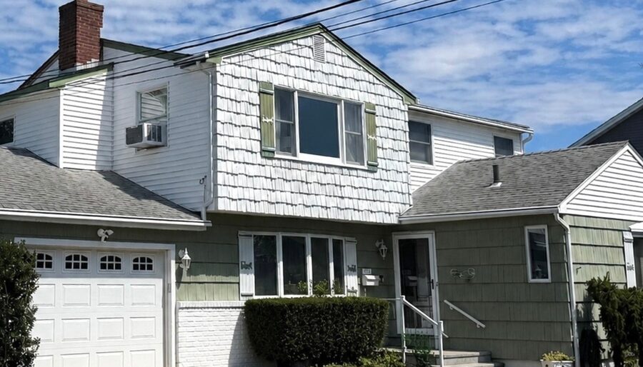 Siding replacement, split-level - before